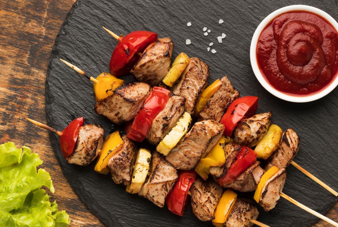 top-view-of-delicious-kebab-on-slate-with-salad-and-ketchup.jpg